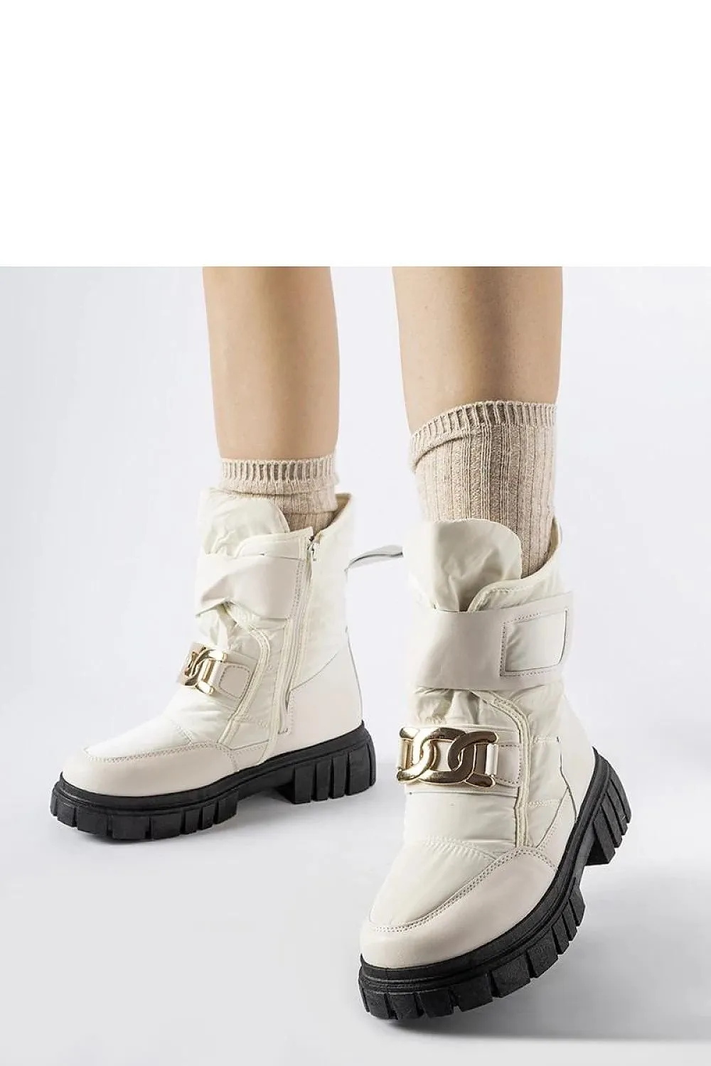 Black snow boots with a decorative buckle