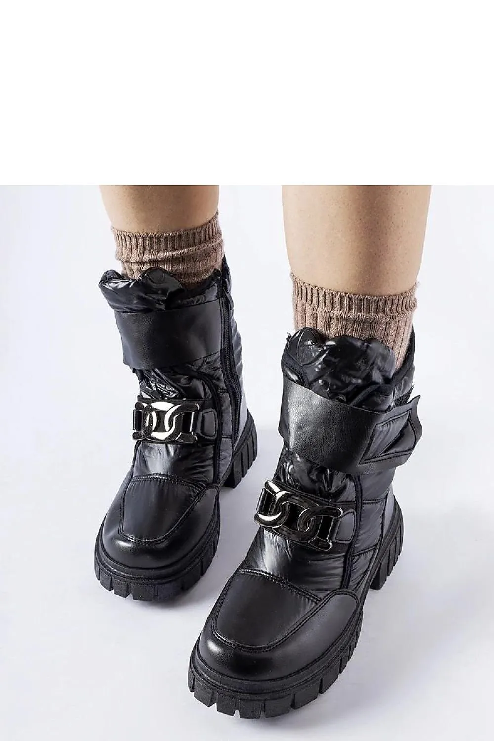 Black snow boots with a decorative buckle