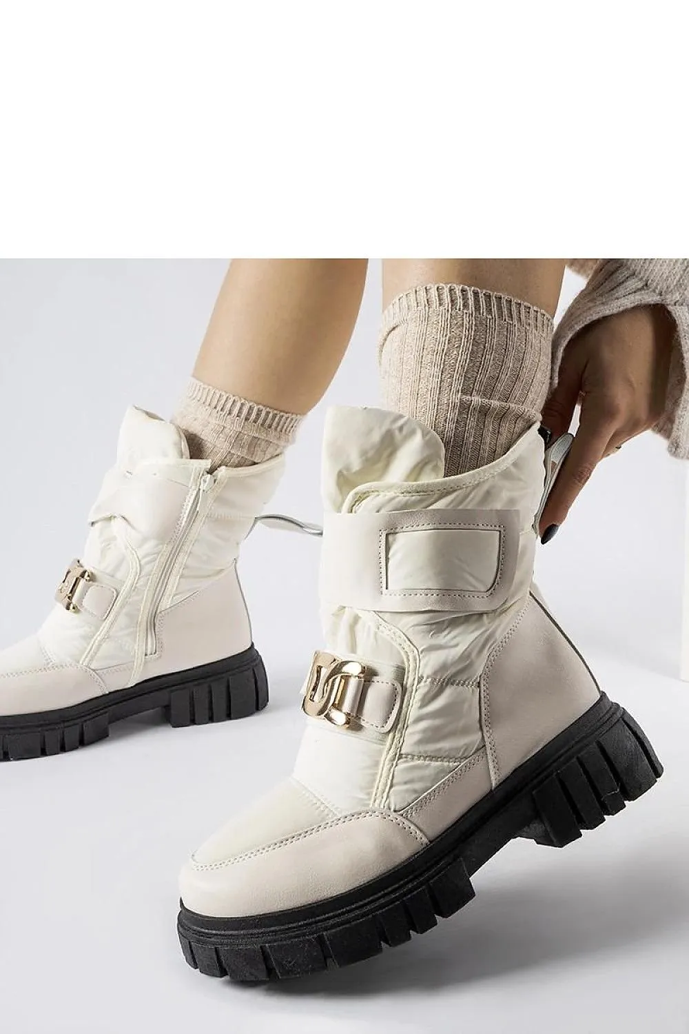 Black snow boots with a decorative buckle